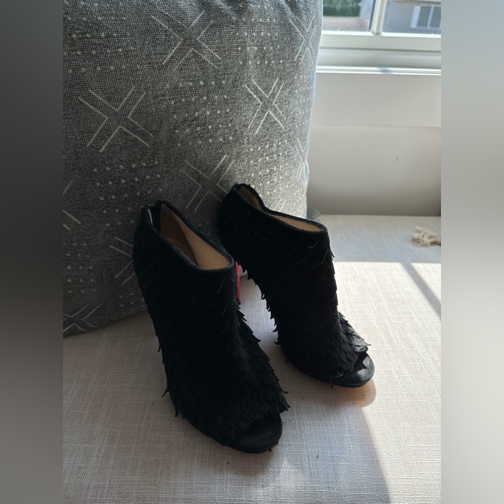 Christian Louboutin open-toed suede bootie heels.